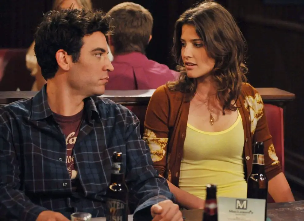 Ted and Robin are sitting at the bar