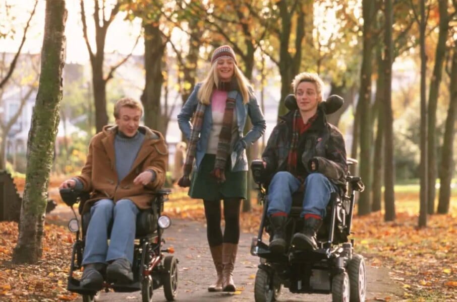 Michael and Rory ride around town in wheelchairs
